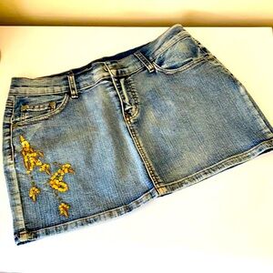 Embellished  jeans mini skirt. Nice quality denim with stretch for comfort.